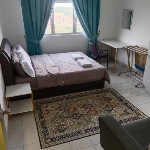 a bedroom with a bed and a couch and a window at Homestay King Putrajaya sebelah Alamanda in Putrajaya