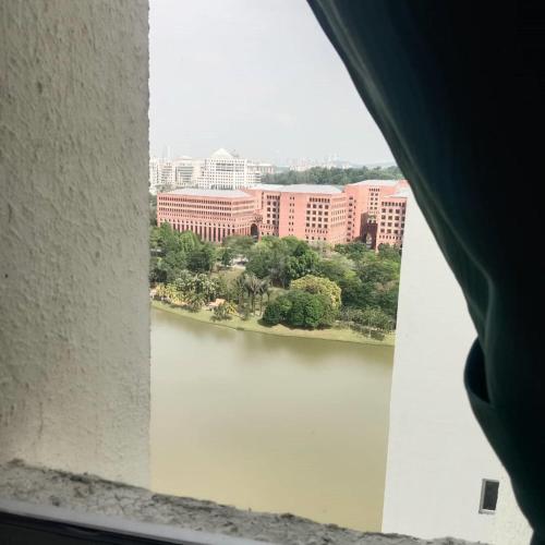 a view of a river from a window at Homestay King Putrajaya sebelah Alamanda in Putrajaya