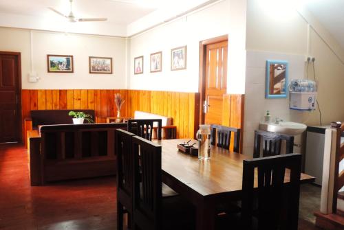a dining room with a table and a sink at Kharjap Homestay in Dirang Dzong