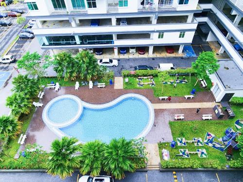 an overhead view of a swimming pool in a resort at KLIA Ehsan Residence Pool View 8 PAX Air-Con Home in Sepang