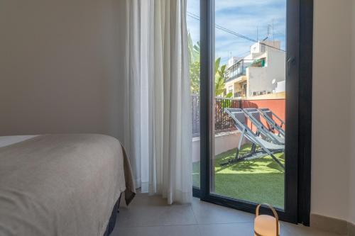 Postel nebo postele na pokoji v ubytování Alidreams Lola Center Apartamentos