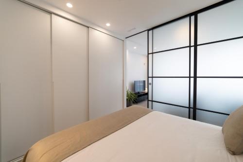 Katil atau katil-katil dalam bilik di Alidreams Lola Center Apartamentos