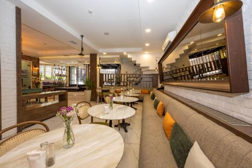 a restaurant with two tables and chairs and a counter at The Marions Suite istanbul Special Category Taksim in Istanbul
