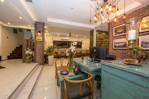 a lobby of a store with a counter and chairs at The Marions Suite istanbul Special Category Taksim in Istanbul