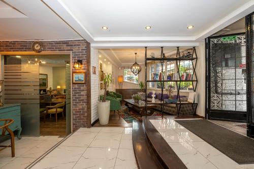 a living room with a brick wall at The Marions Suite istanbul Special Category Taksim in Istanbul