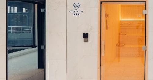 a door to a building with a sign on it at OTIA HOTEL in Maputo