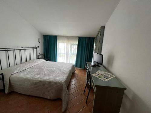 Postel nebo postele na pokoji v ubytování Hotel Residence La Ventola