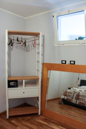 a bedroom with a bunk bed and a window at Casa Vacanze "A Machina Ro Ghiaccio" in Noto