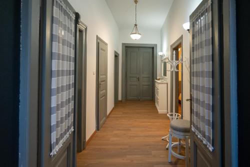 a hallway with blue and white tiles on the walls at Kinsley Apartment 1 in Timişoara