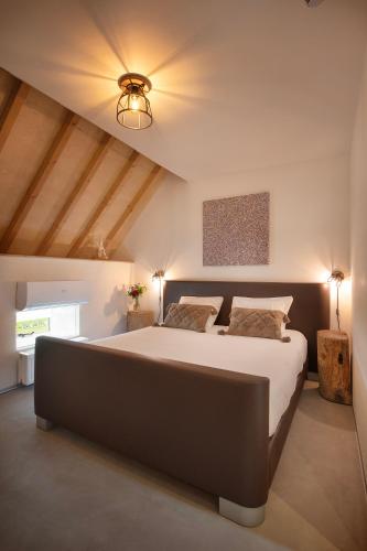a bedroom with a large bed in a room at B&B Le Rêve Maastricht in Maastricht