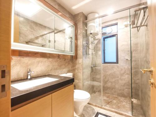 a bathroom with a sink and a shower at R&F Princess Cove CIQ Premium Sea & City view Suites by NEO in Johor Bahru