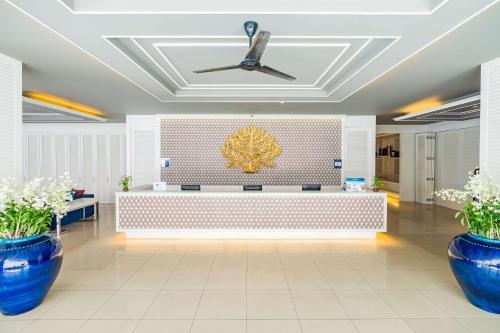 a lobby with blue vases and a ceiling at Best Western Patong Beach in Patong Beach