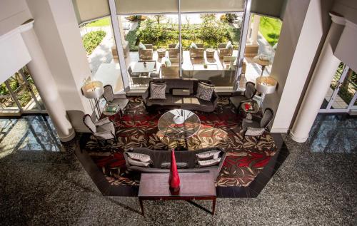 an overhead view of a living room with a table and chairs at Garden Court Morningside Sandton in Johannesburg
