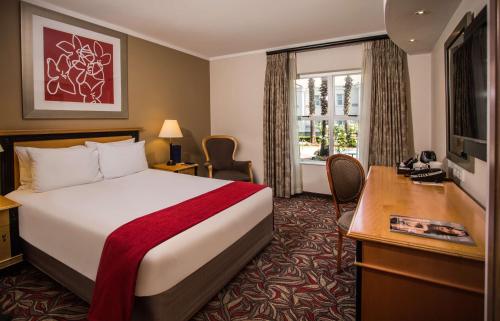 Postel nebo postele na pokoji v ubytování Garden Court Morningside Sandton