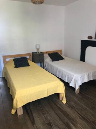 Postel nebo postele na pokoji v ubytování Duplex au Village