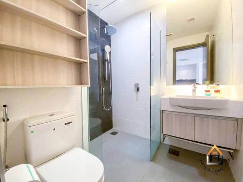 a bathroom with a toilet and a sink and a shower at Suasana Residence JB City Lifestyle Suites by NEO in Johor Bahru