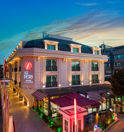 an as pips building on a city street at night at Aspera Hotel Altunizade in Istanbul