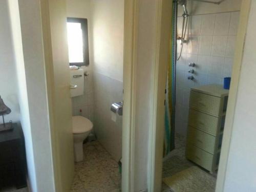 a bathroom with a toilet and a sink and a shower at Studio Hadera in H̱adera