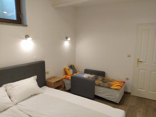 Postel nebo postele na pokoji v ubytování Apartmaji Maln