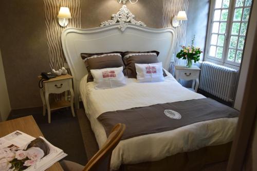 Giường trong phòng chung tại Le Petit Relais