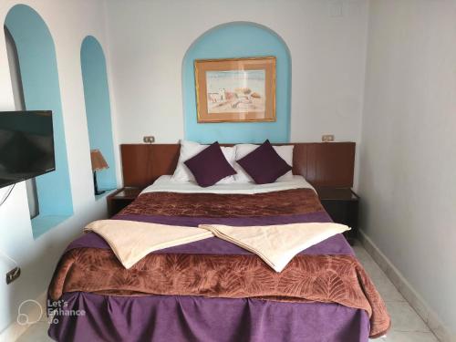 Uma cama ou camas num quarto em Halomy Sharm Resort