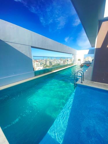 a swimming pool on the top of a building at Topacio Tower apartamento de lujo in Buenos Aires