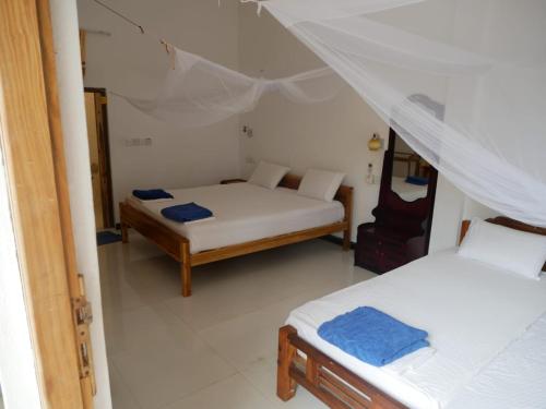 Ein Zimmer in der Unterkunft SURF & SAND Hotel Arugamby