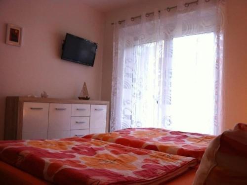 En eller flere senge i et værelse på Gemütliche 75 qm Wohnung mit Balkon und Blick auf das Goldeck
