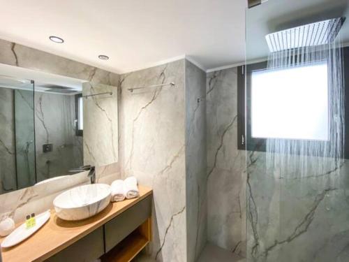 a bathroom with a sink and a shower at Magdalena Suite 2.0 in Heraklio