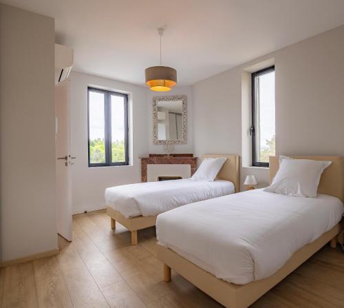 Posteľ alebo postele v izbe v ubytovaní Sous les remparts la maison Pimprenelle
