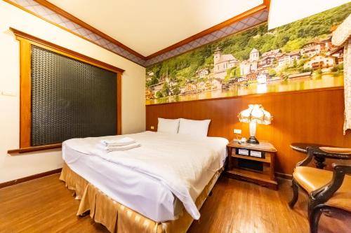 Postel nebo postele na pokoji v ubytování I HI Sanduo Travel Hotel