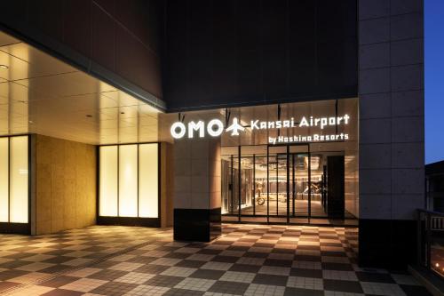 an entrance to the omni hotel at night at OMO Kansai Airport by Hoshino Resorts in Izumi-Sano