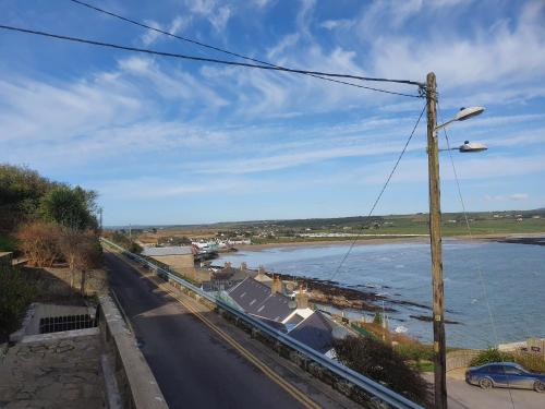 a view of a river and a street with a pole at Hillside in Ardmore