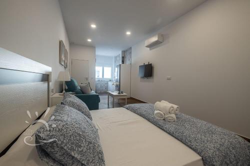 Posteľ alebo postele v izbe v ubytovaní Apartamentos DOM ROOM