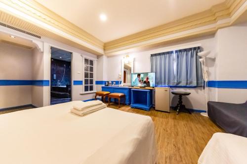 Postel nebo postele na pokoji v ubytování I HI Sanduo Travel Hotel