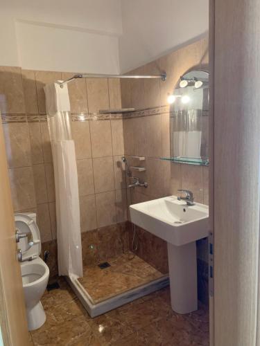 a bathroom with a sink and a toilet at κοχύλι 1 in Armenistis