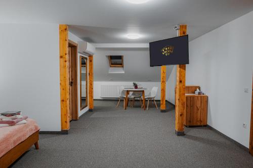 a room with a bed and a table in it at The Dom 21 in Cluj-Napoca