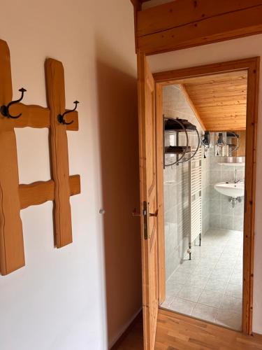 a bathroom with a glass door leading to a shower at Casa Boebelle 3 km von der Therme Bükfürdö in Bük