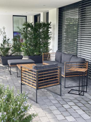a group of benches and tables on a patio at Traumblick Vallendar 2.0 in Vallendar