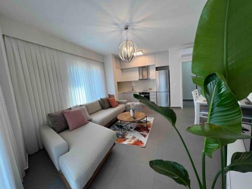 a living room with a couch and a table at Mozart House - Spacious Luxury Apartment - Heart of the City in Tirana