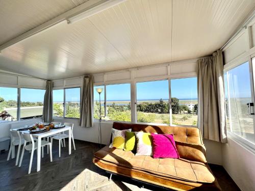 a living room with a couch and a table at Tavira Vila Formosa 6 With Pool by Homing in Tavira