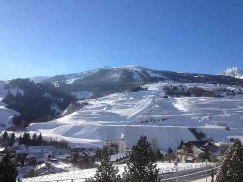 a view of a ski resort in the snow at Tgesa Sunnmatt Nr 46 in Savognin