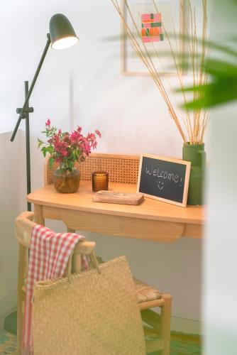 a desk with a table with a laptop on it at CASA DO MIRADOURO 6 by Heart of Funchal in Funchal