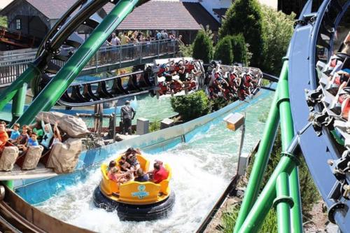 a group of people riding on a roller coaster at Bungalow direkt am See, mit eigenem Boot in Roding
