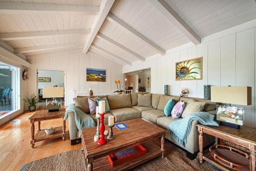 a living room with a couch and a table at 3631 Casa Familia home in Pebble Beach