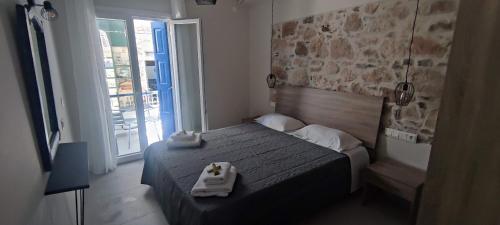Una cama o camas en una habitación de Studios Iris