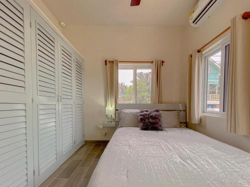 a bedroom with a large bed and a window at San Pablo Villas in San Pedro