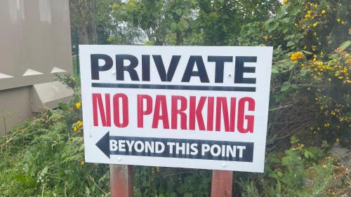 a sign that says private no parking beyond this point at Heatherbrae Guest House in Kyle of Lochalsh