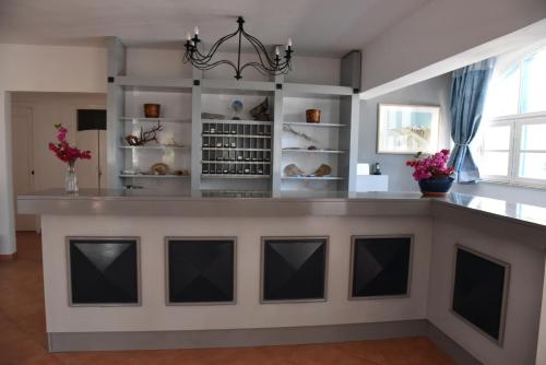 a large island in a kitchen with a counter top at Boutique Hotel Tilos Mare in Livadia