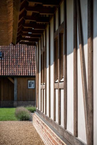 an open window of a house with a porch at Anno 1673 in Evergem